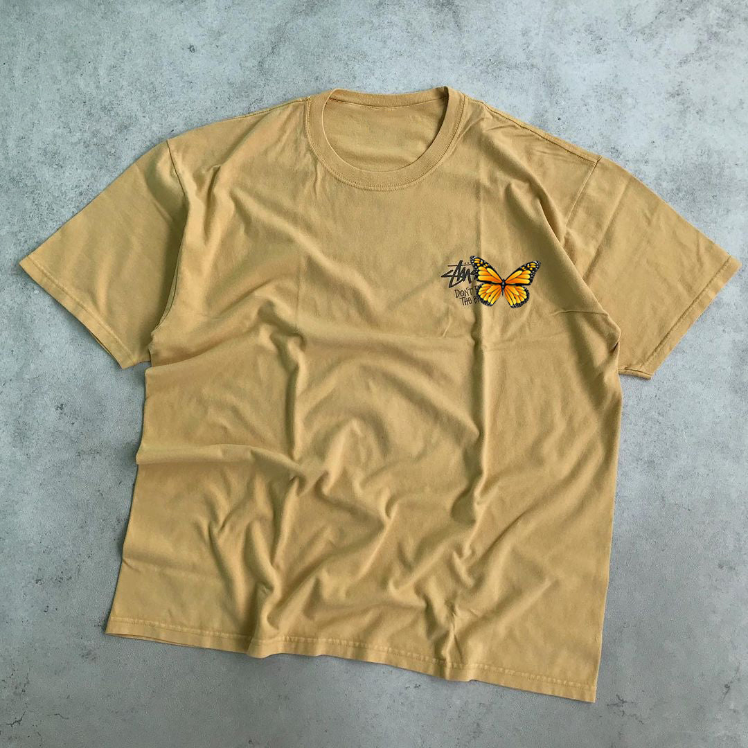 Camiseta de manga corta holgada informal con estampado de calavera y mariposa a la moda